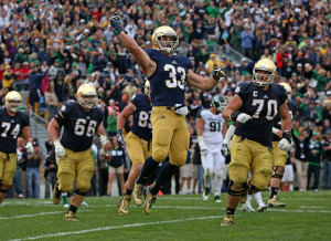 Cam McDaniel celebrates a touchdown against Michigan State.