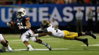 Tre Mason set SEC Championship Game records with 46 carries for 303 yards and 4 TD.