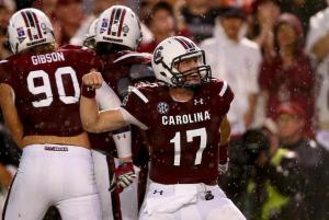 South Carolina QB Dylan Thompson pumps his fist after passing for the first of 2 touchdowns against Georgia. Thompson led the Gamecocks to a 38-35 win over the Bulldogs.