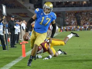 Brett Hundley runs into the end zone as he leads his UCLA Bruins past the USC Trojans.