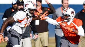 Former Auburn QB Nick Marshall covers his former teammate Sammie Coates in practice. Marshall created a buzz when he decided to work our as a corner instead of quarterback.
